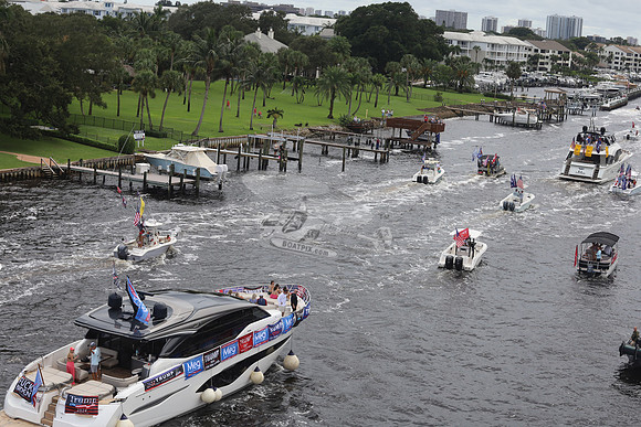 big speedboat.flags.palm beach.1