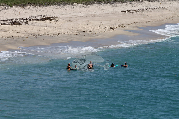 5 people in ocean water.