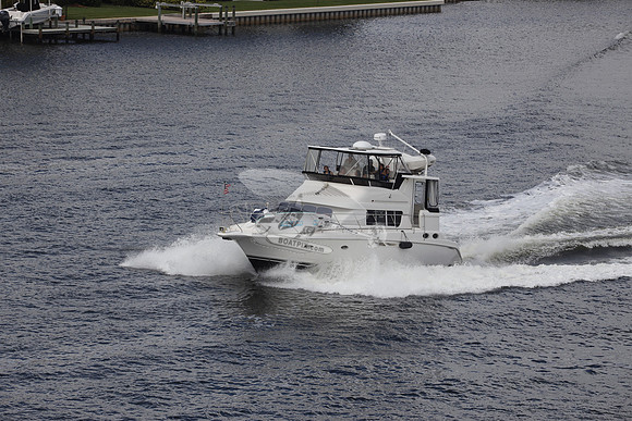 BOAT.WHITE HULL.SURFSTAR SURFBOARD IN FRONT.04