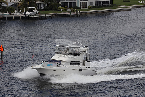 BOAT.WHITE HULL.SURFSTAR SURFBOARD IN FRONT.06