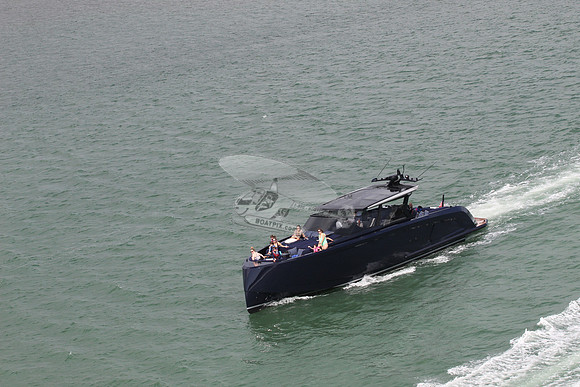 big blue or black boat.12