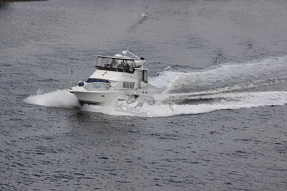 BOAT.WHITE HULL.SURFSTAR SURFBOARD IN FRONT.03