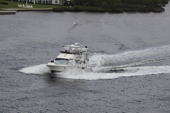 BOAT.WHITE HULL.SURFSTAR SURFBOARD IN FRONT.02