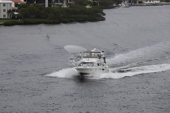 BOAT.WHITE HULL.SURFSTAR SURFBOARD IN FRONT.01