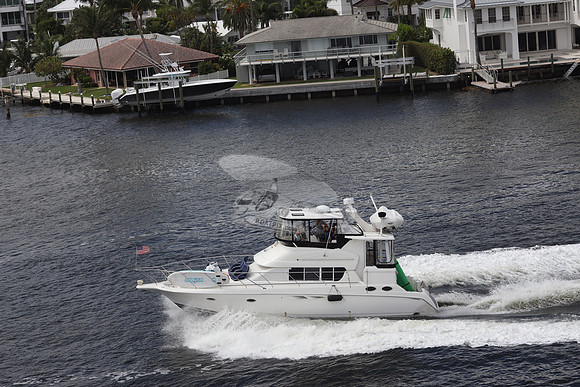 BOAT.WHITE HULL.SURFSTAR SURFBOARD IN FRONT.15