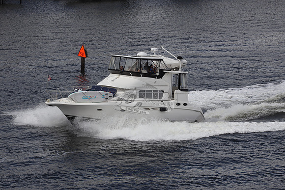 BOAT.WHITE HULL.SURFSTAR SURFBOARD IN FRONT.07