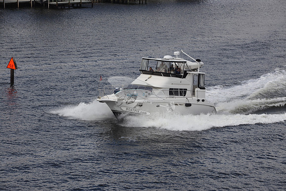 BOAT.WHITE HULL.SURFSTAR SURFBOARD IN FRONT.05
