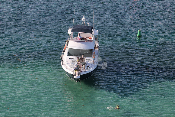 blue boat.white top.lots people.21