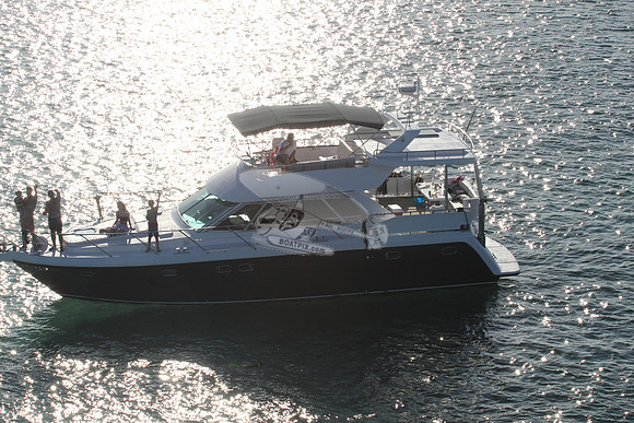 blue boat.white top.lots people.14