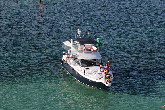 blue boat.white top.lots people.23