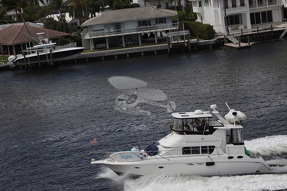 BOAT.WHITE HULL.SURFSTAR SURFBOARD IN FRONT.14
