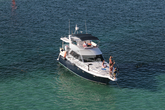 blue boat.white top.lots people.24