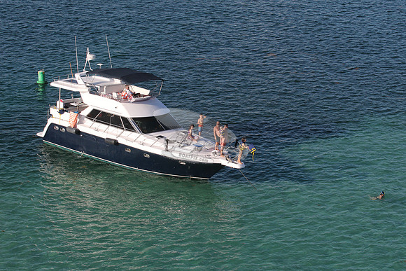blue boat.white top.lots people.26