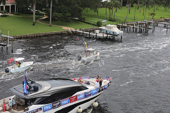 big speedboat.flags.palm beach.2