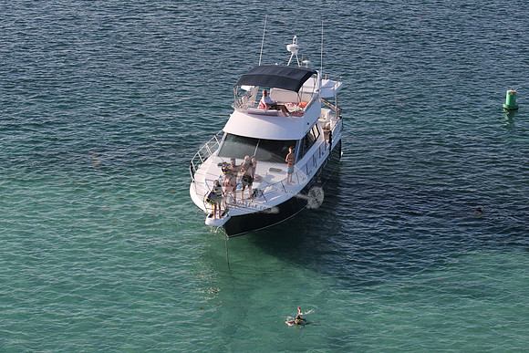 blue boat.white top.lots people.20