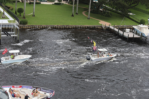 big speedboat.flags.palm beach.3