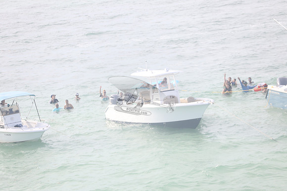 BOSTON WHALERS & PEO IN WATER.15