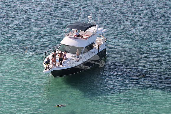 blue boat.white top.lots people.19