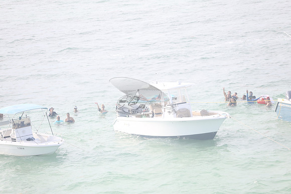 BOSTON WHALERS & PEO IN WATER.14
