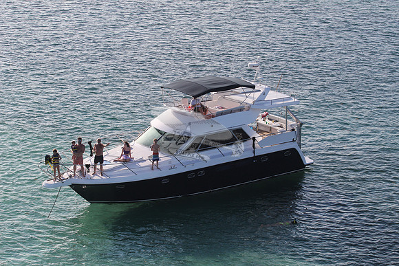 blue boat.white top.lots people.16