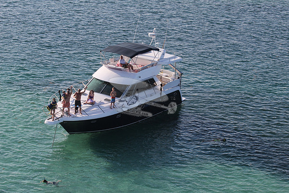 blue boat.white top.lots people.18